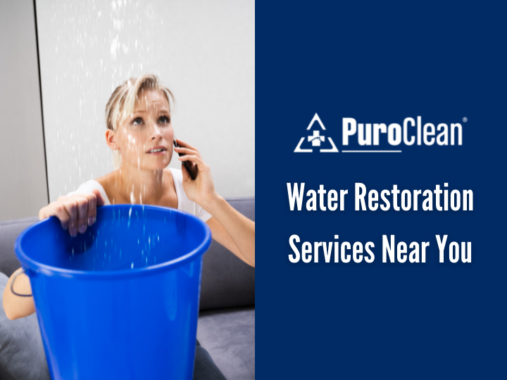 A woman is talking on a cell phone while holding a blue bucket