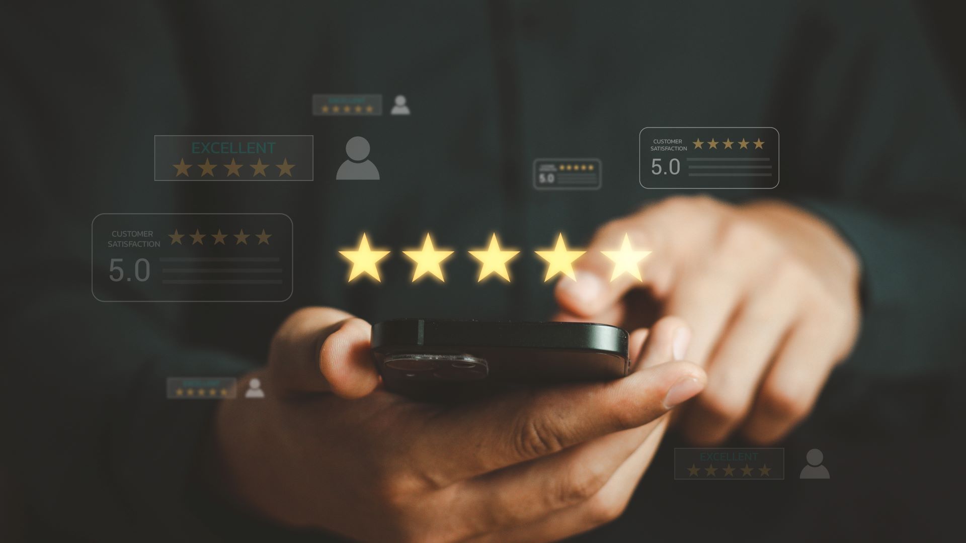A person is holding a cell phone with five stars on it.