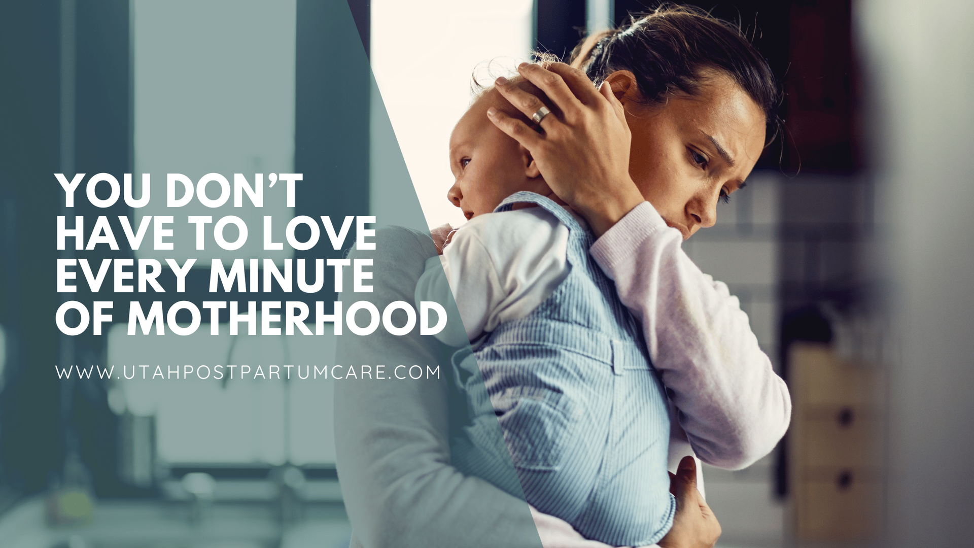 A mother holds her baby and rests her hand on his hand to comfort him.