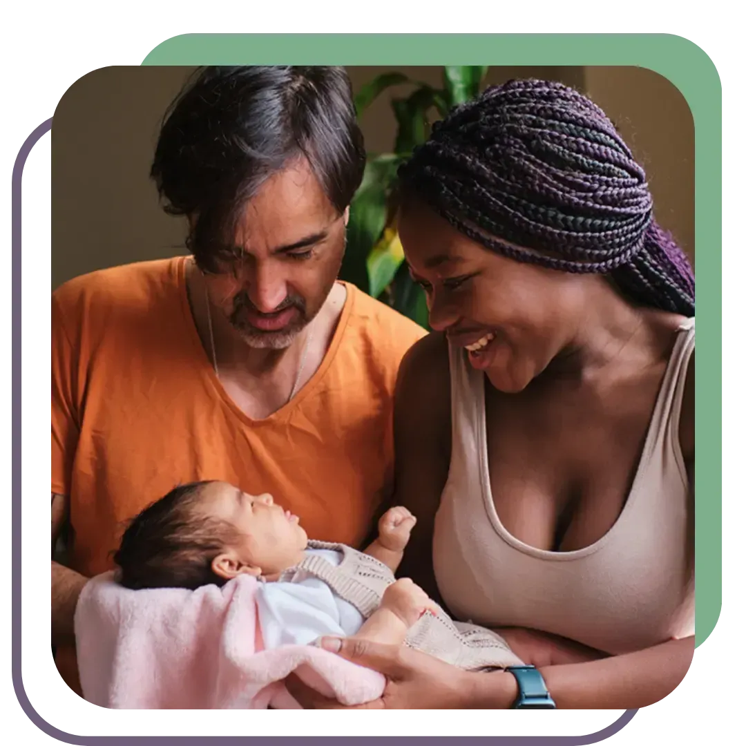 Smiling parents bonding with their newborn baby at home, supported by Utah postpartum doula services for rest and recovery.