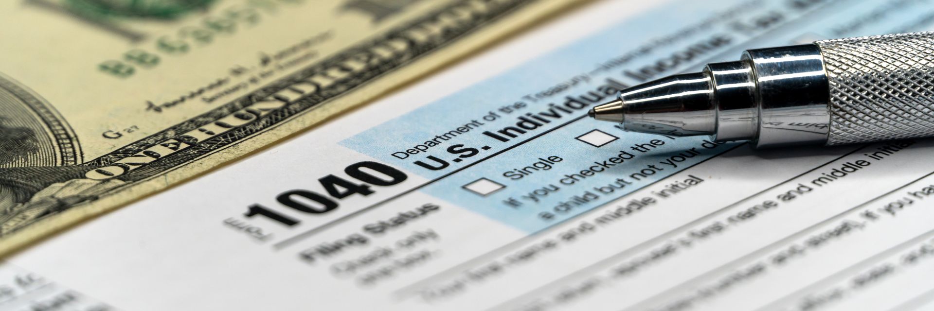 1040 tax form with pen