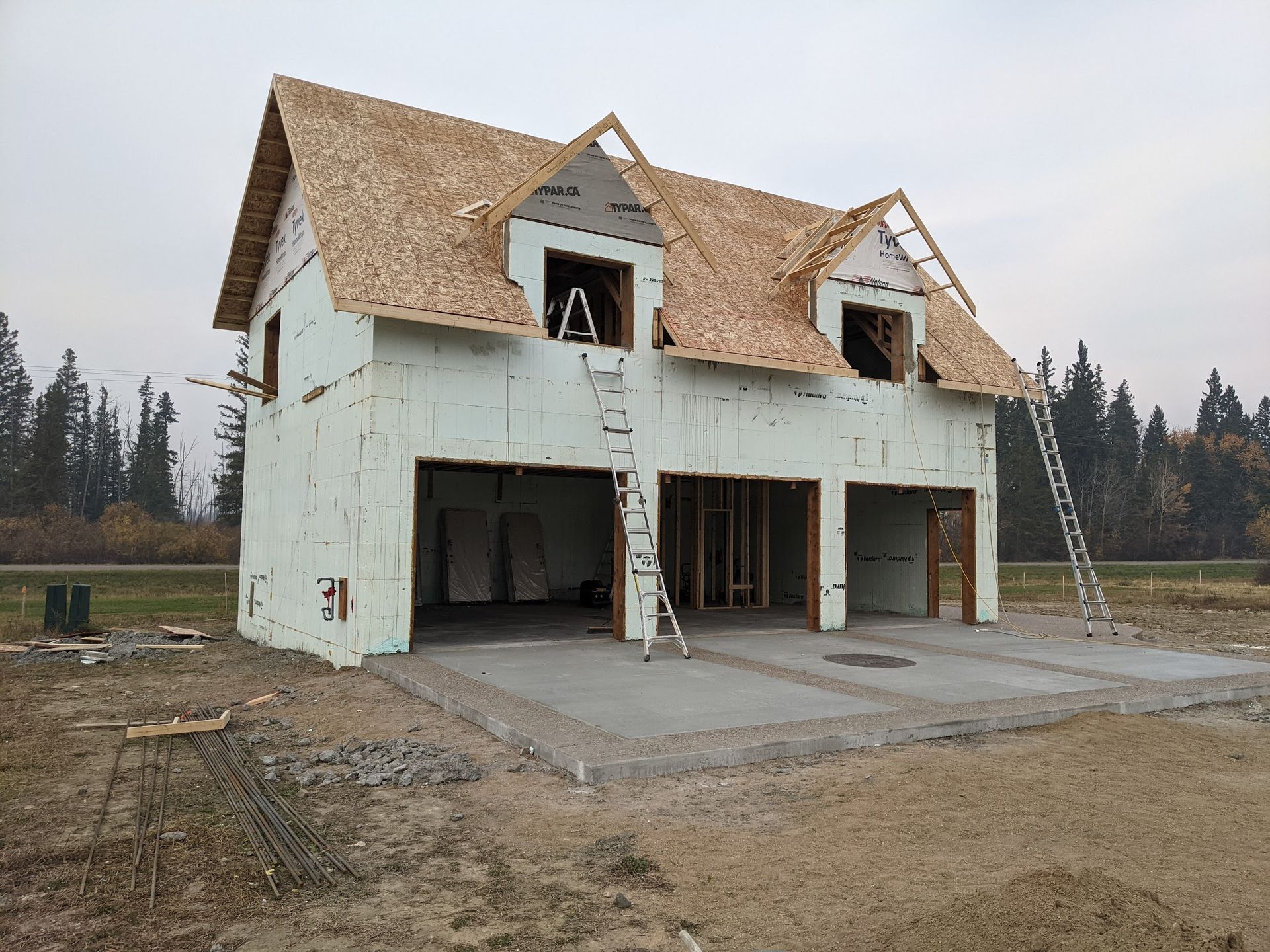 A house that is being built with a ladder in front of it