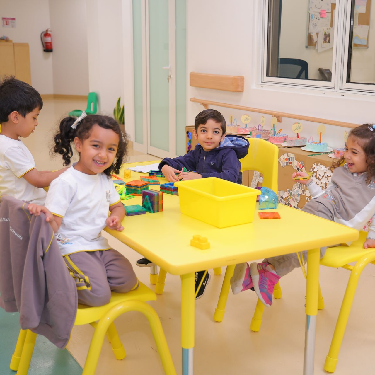A boy and a girl are reading a book together
