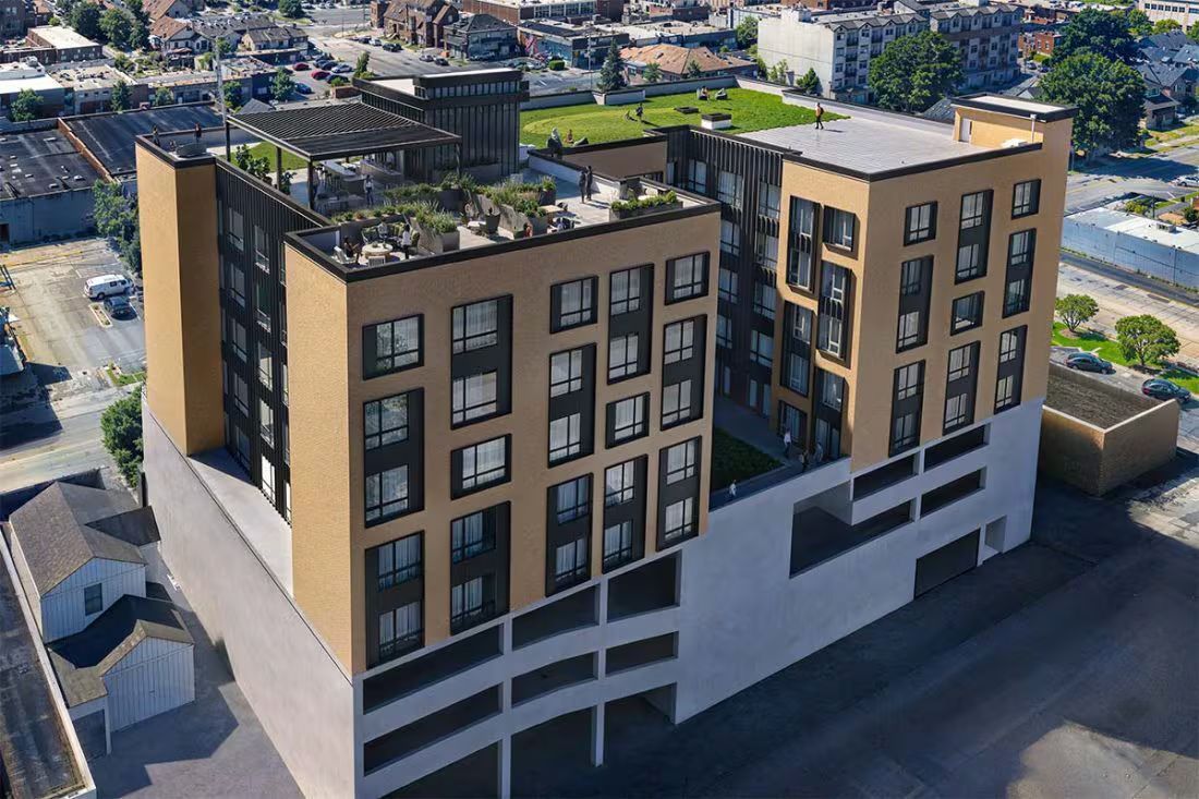Rendering showing a multi-story building from a bird's eye view, allowing the rooftop deck to be seen
