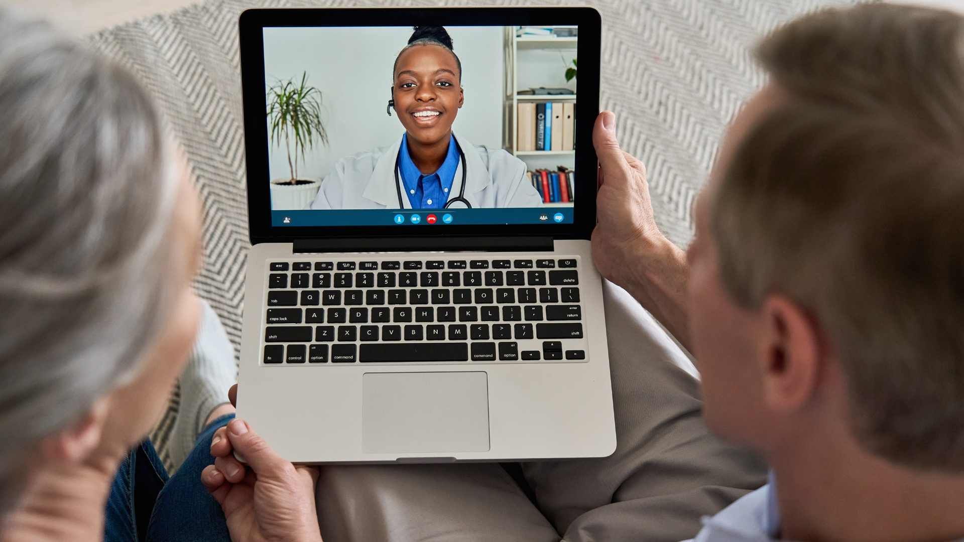 Couple doing televisit with a dr