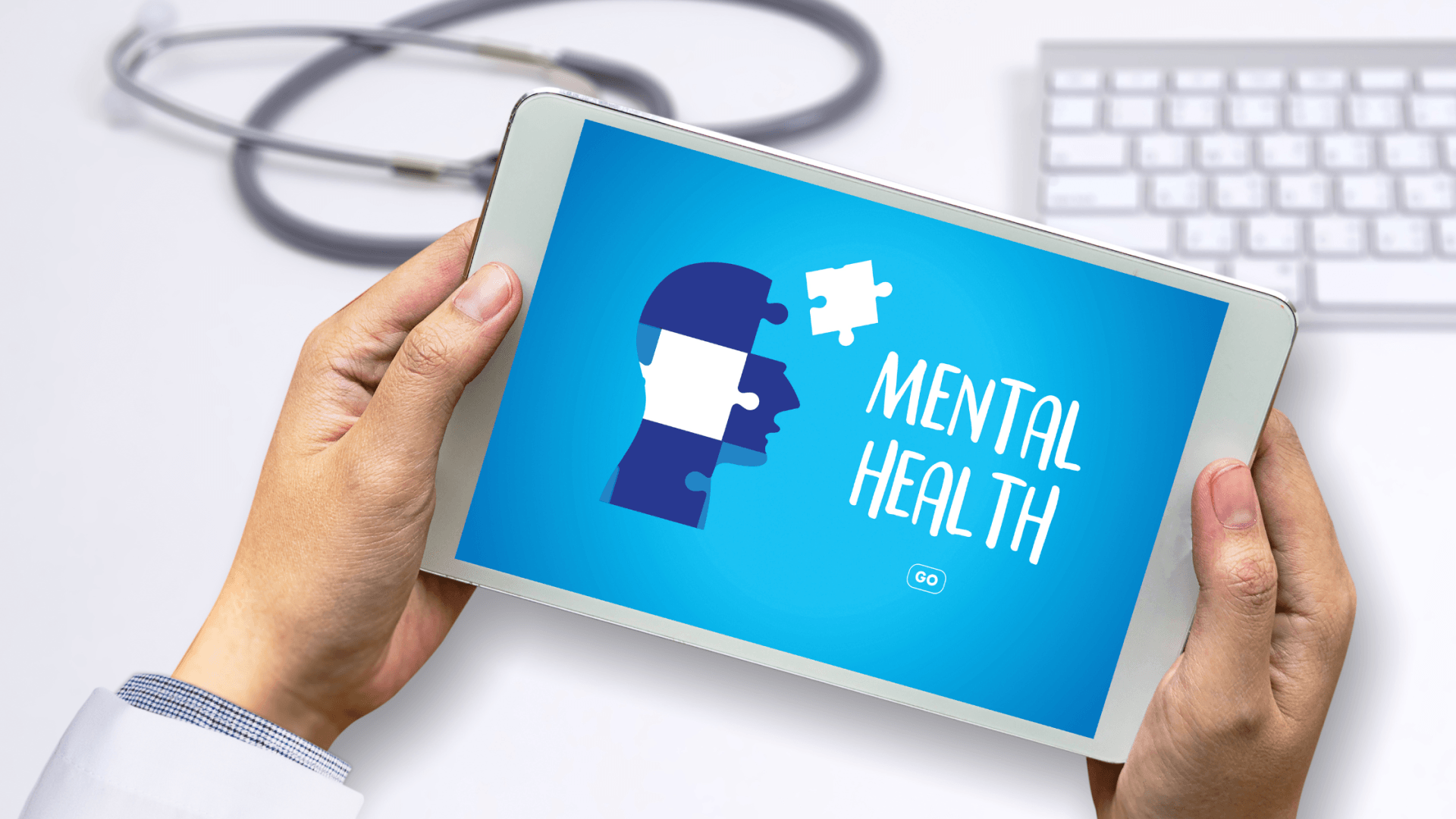 doctor holding a tablet on both hands with screen that says