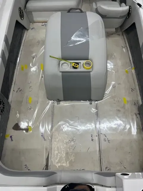 Boat interior with protective plastic on the floor. 