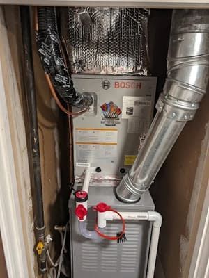 Duct sealing and leak repair in Woodland attic space.