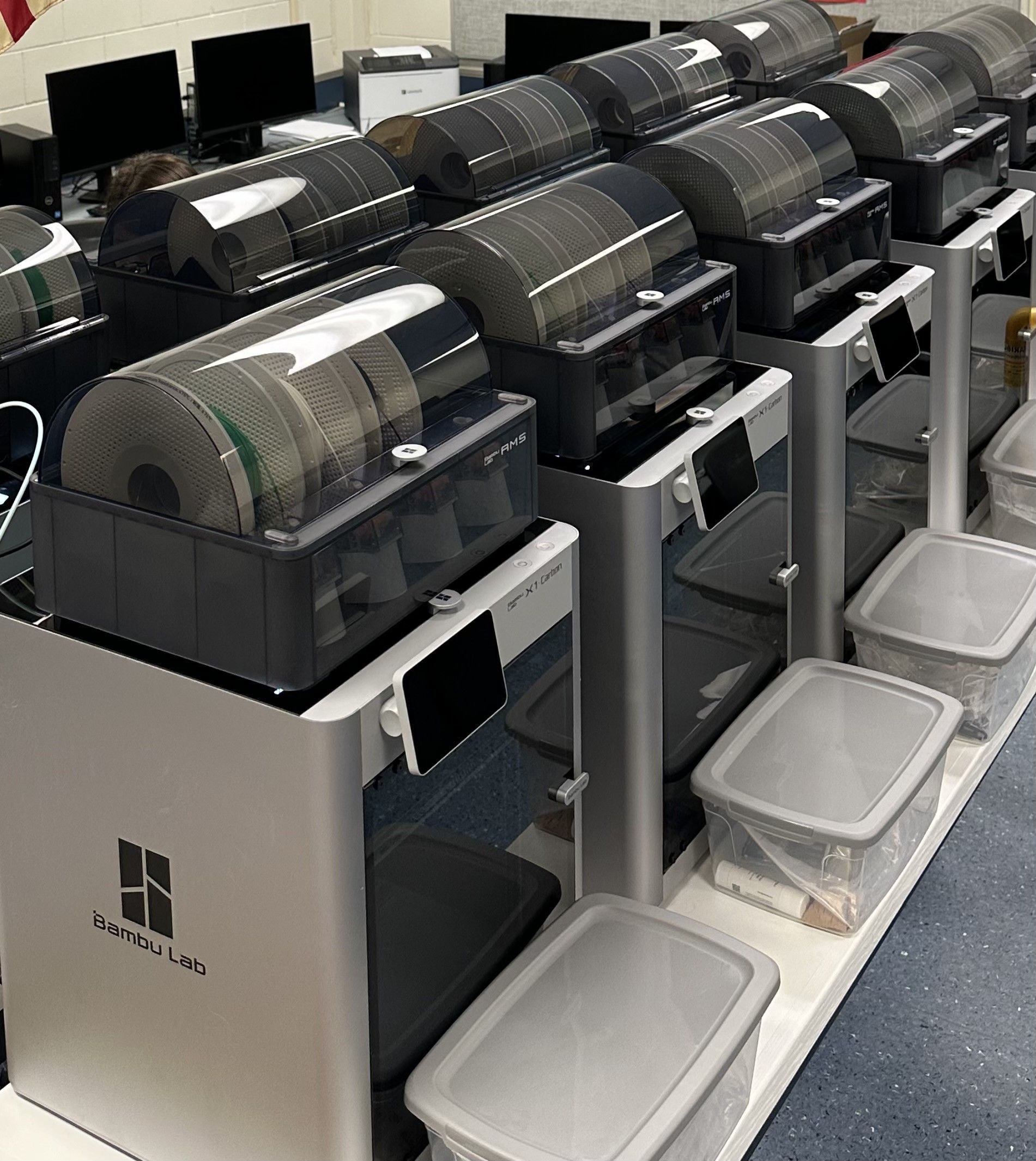 A classroom filled with Bambulabs X1C 3D Printers