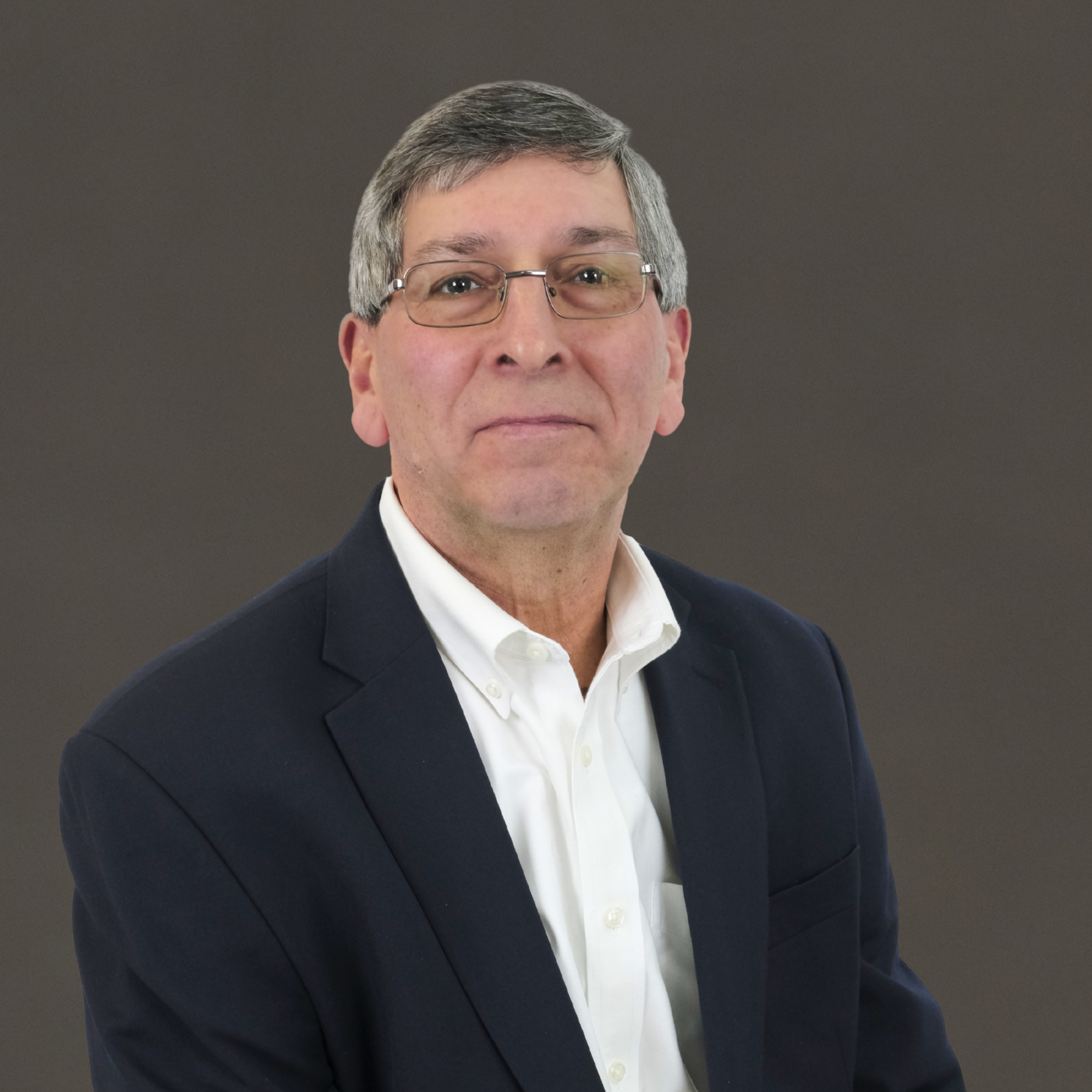 Michael Galante, IBTS Senior Director of Business Development, wearing a white shirt and black blazer
