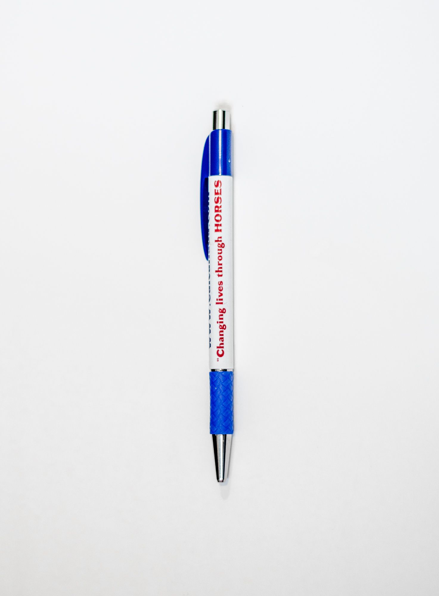 A blue and white pen with the word lal on it