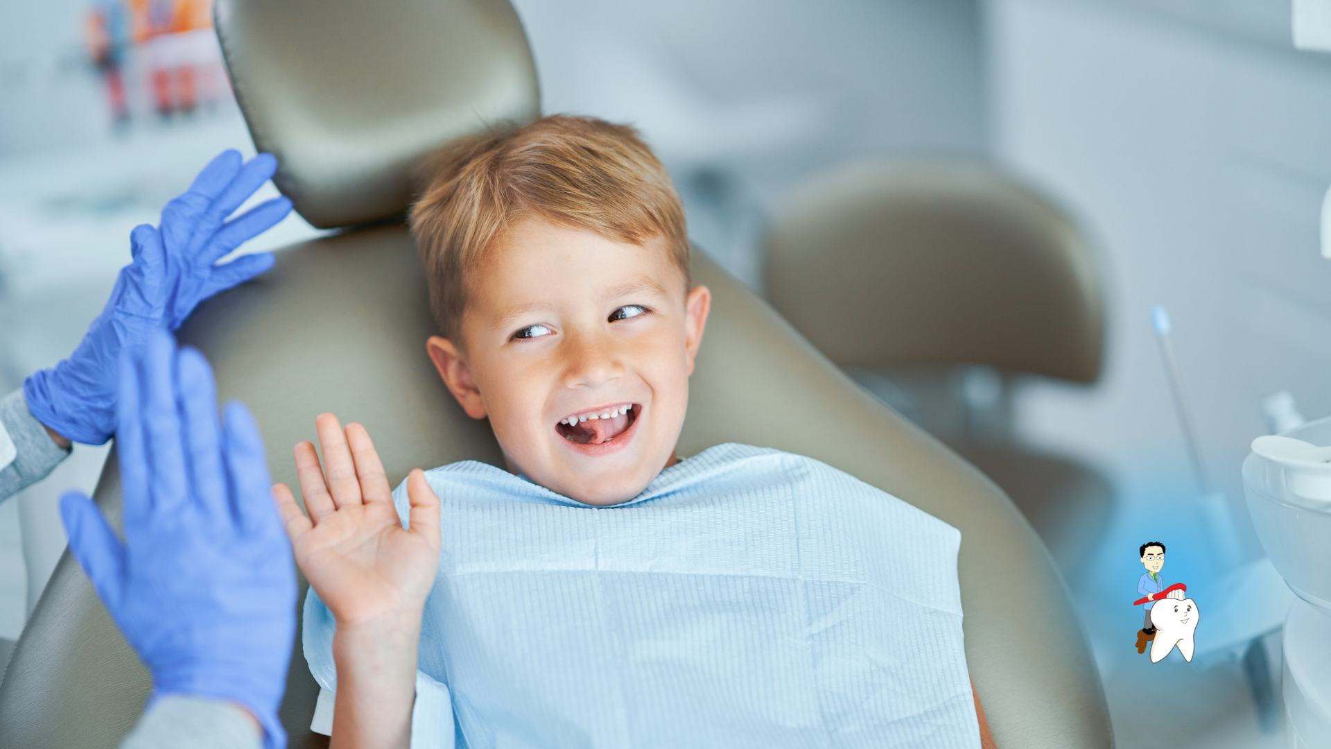 A young boy is sitting in a dental chair giving the dentist a high five.