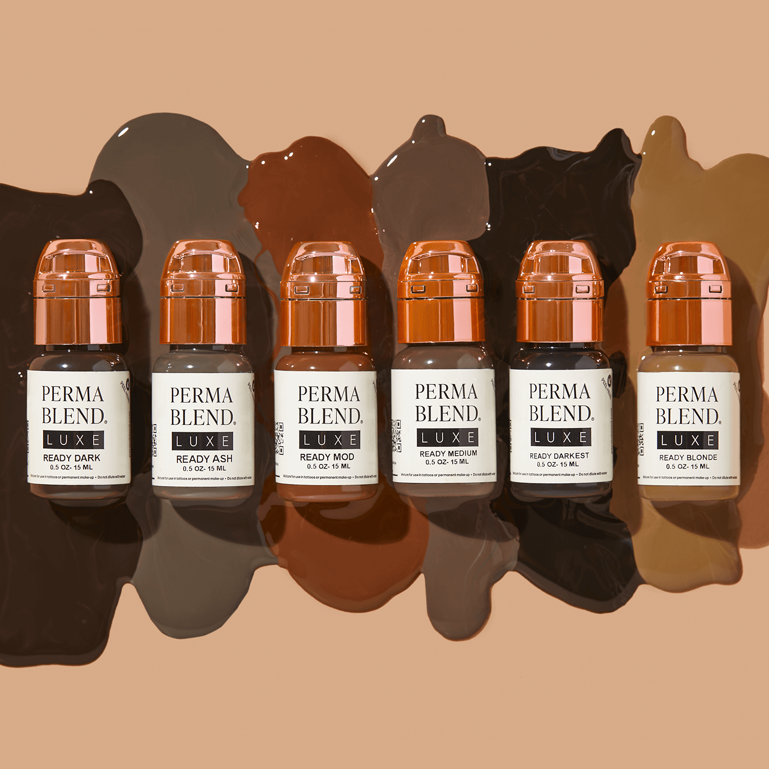 Six amber skincare bottles with copper caps arranged in a row on a tan background with shadows.
