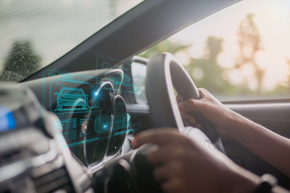 A Person Is Driving A Car With A Futuristic Dashboard — Canberra Windscreens In Tuggeranong, ACT