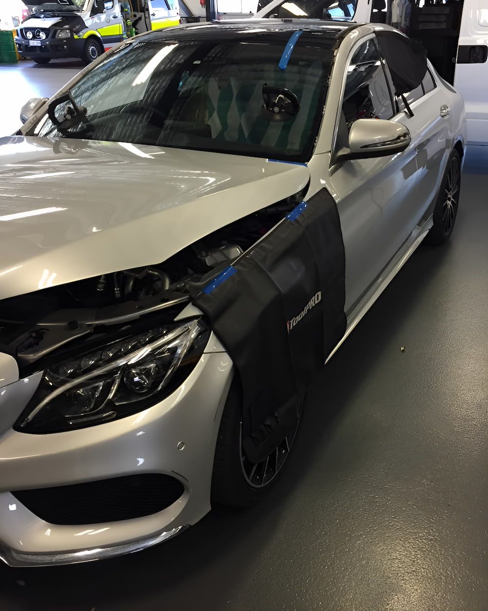 A Silver Car With The Hood Open Is Parked In A Garage — Canberra Windscreens In Fyshwick, ACT