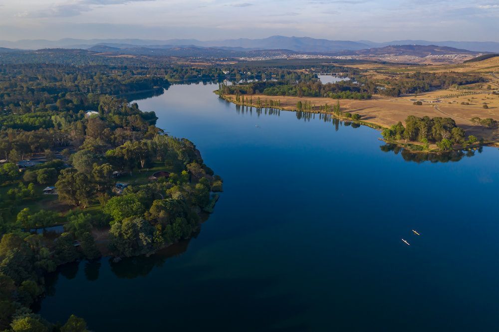 An Aerial View Of A Lake With A Small Island In The Middle — Canberra Windscreens In Weston Creek, ACT