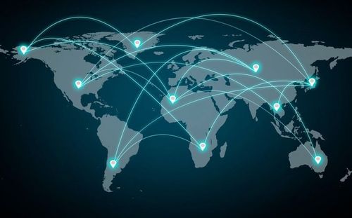 Glowing network lines linking city nodes across a world map on a dark background