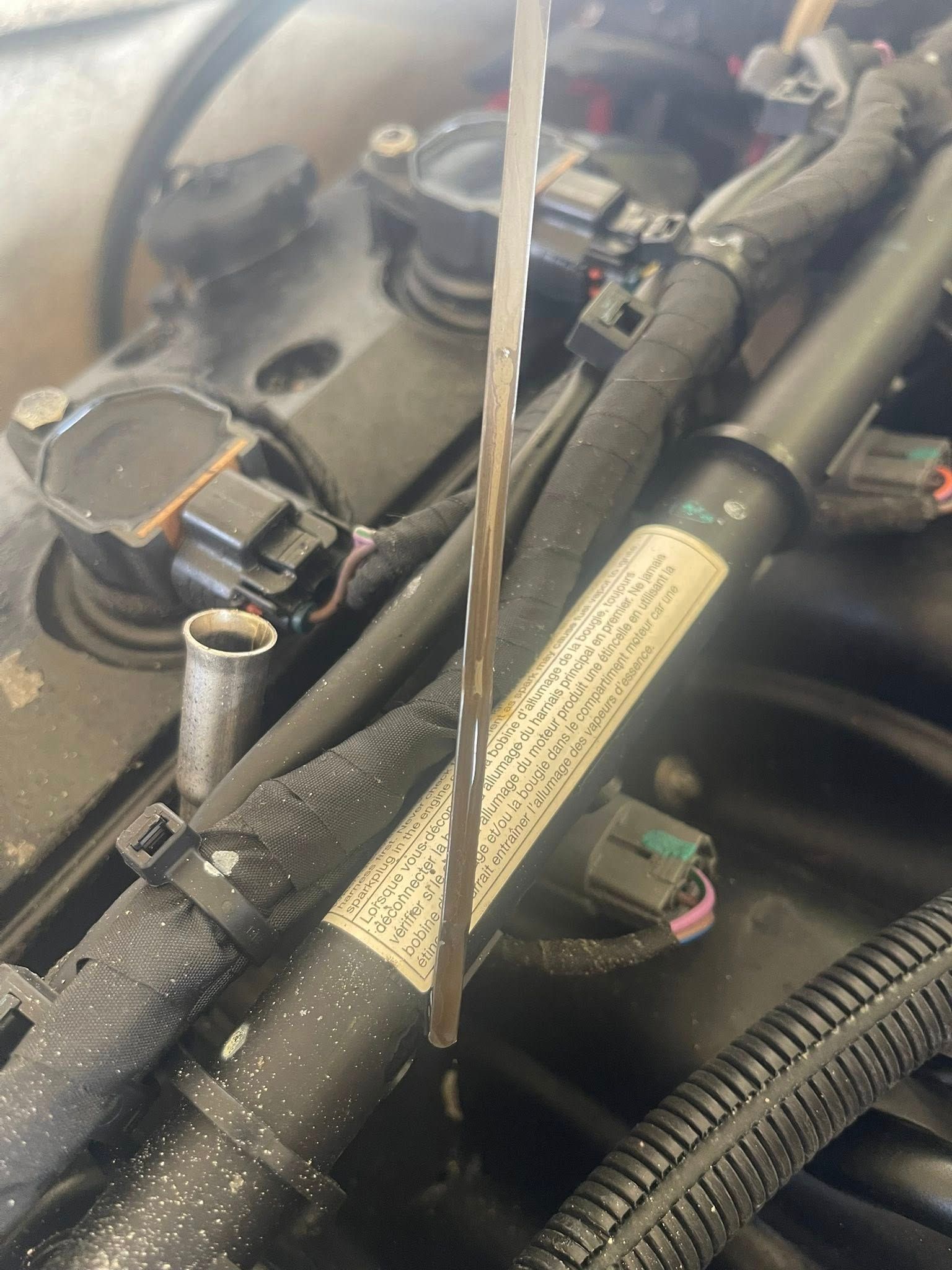 A Close-up View of an Engine Oil Dipstick Held Vertically — Hastings Mobile Marine Services In Laurieton, NSW