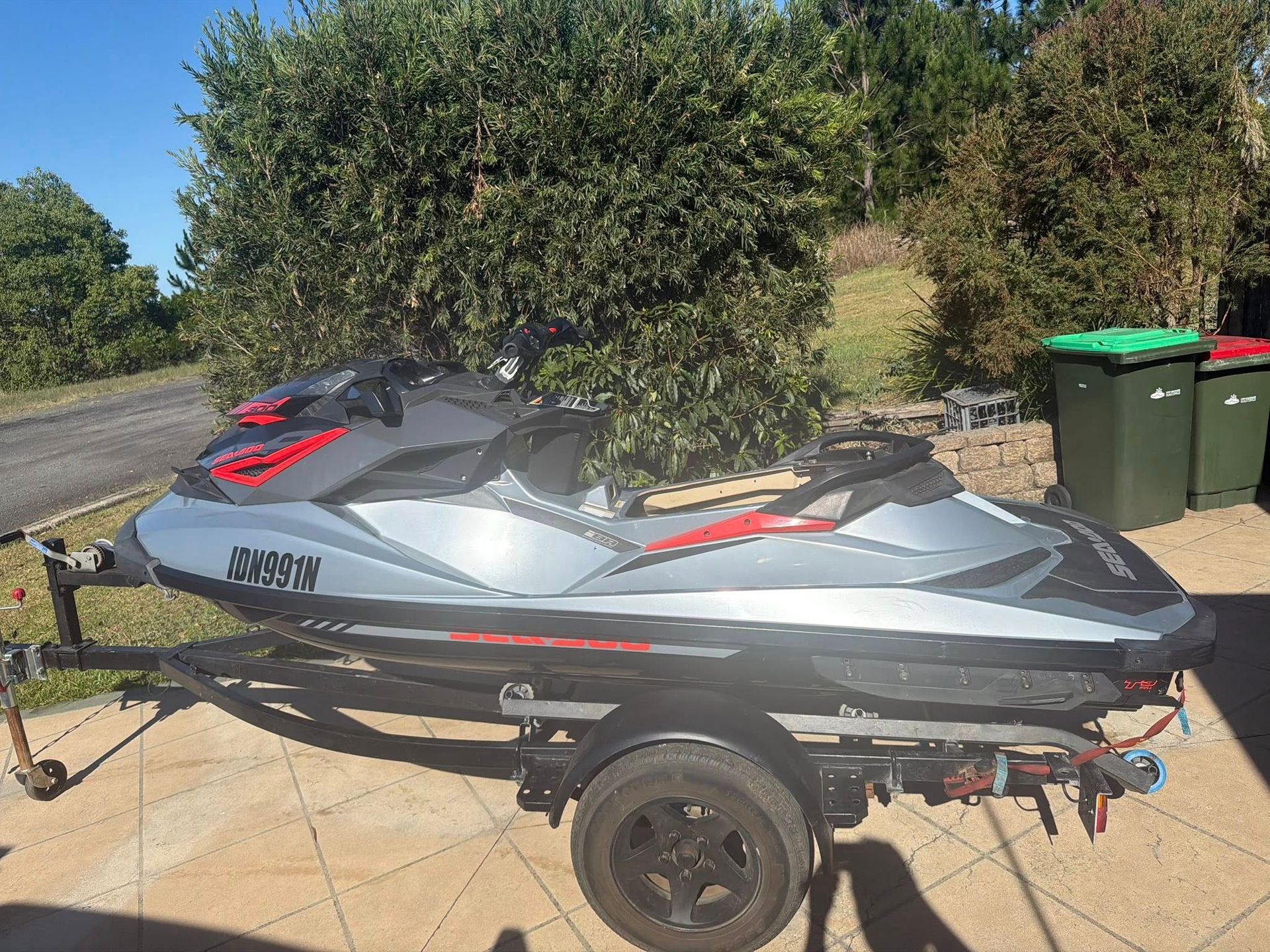 A Silver and Black Sea-doo Jet Ski on a Trailer Parked Outdoors — Hastings Mobile Marine Services In Wauchope, NSW