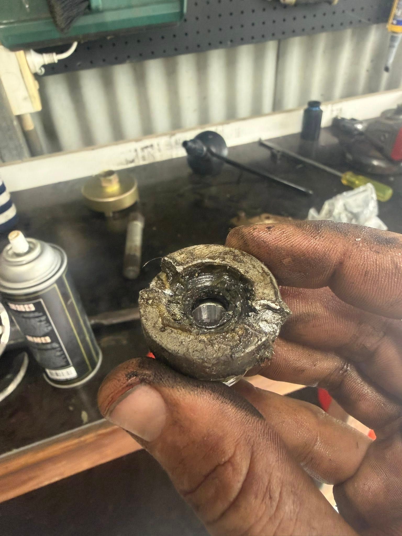 A Person Holds a Grease-covered Mechanical Part — Hastings Mobile Marine Services In Wauchope, NSW