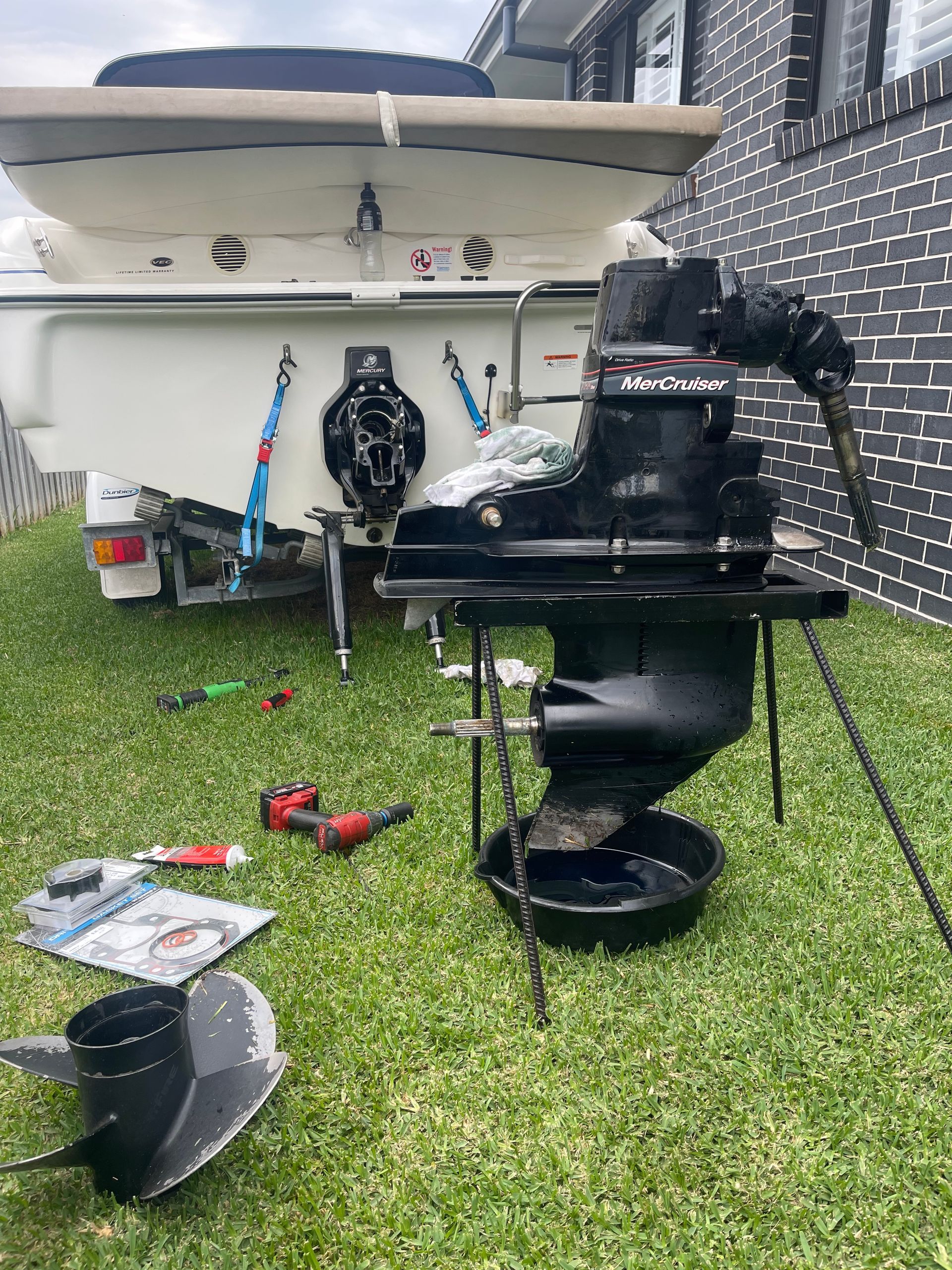 A Black Boat Outdrive Removed From the Transom of a Boat — Hastings Mobile Marine Services In Kempsey, NSW