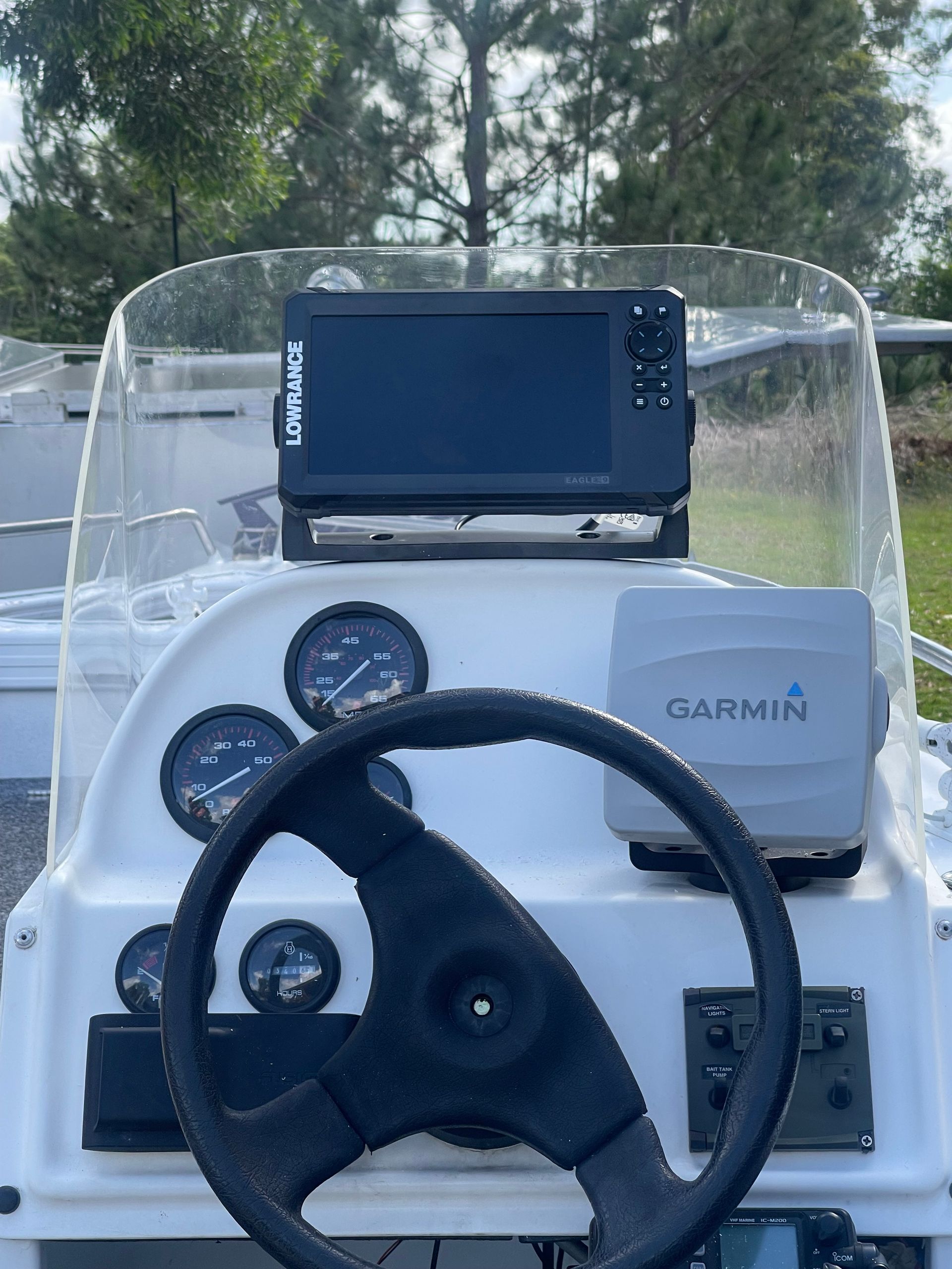 The Helm of a Boat, Featuring a Steering Wheel, Gauges and a Garmin Unit — Hastings Mobile Marine Services In Wauchope, NSW