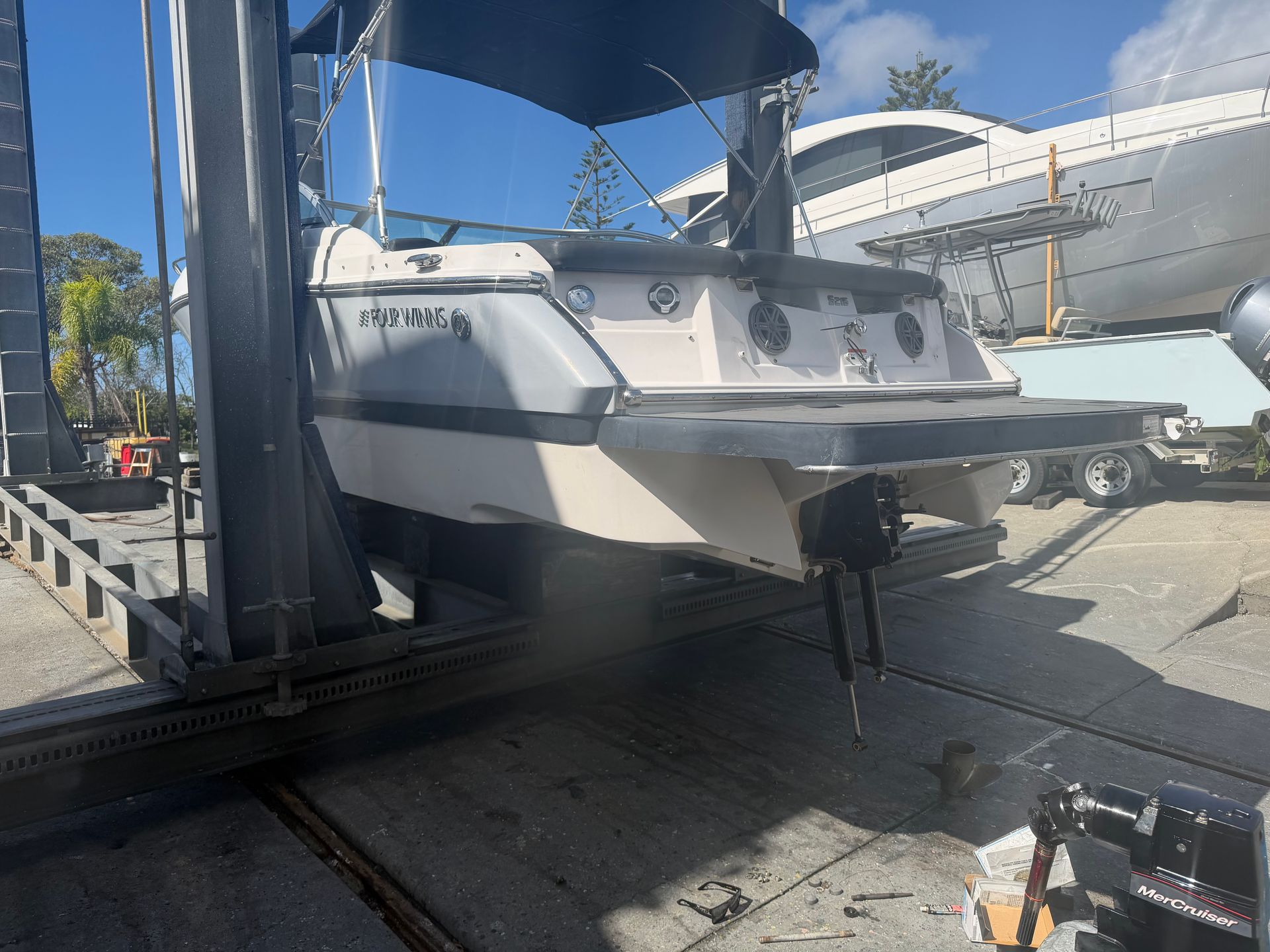 A White and Gray Boat Sits on a Metal Rack System — Hastings Mobile Marine Services In Kempsey, NSW