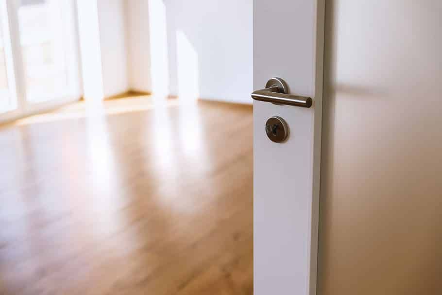 opened-white-interior-door-new-home