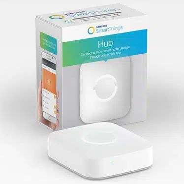 A smartthings hub is sitting next to its box.