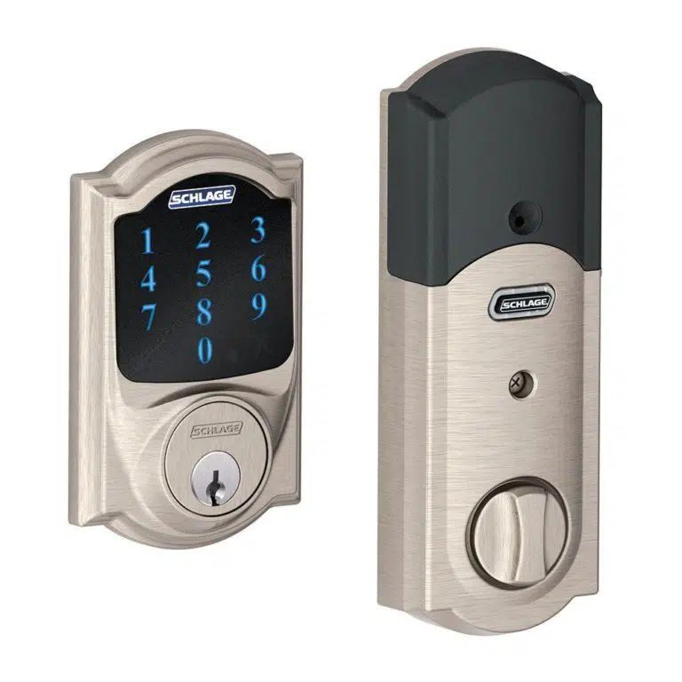 A stainless steel door lock with a digital display and a key.