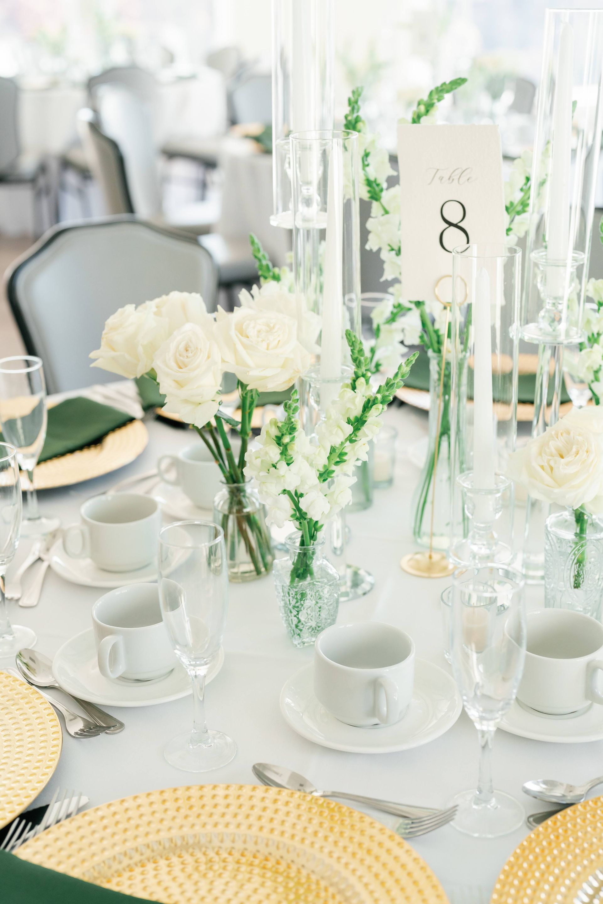 CENTERPIECE WITH ROSE BUDS AND HURRICANE CANDLES