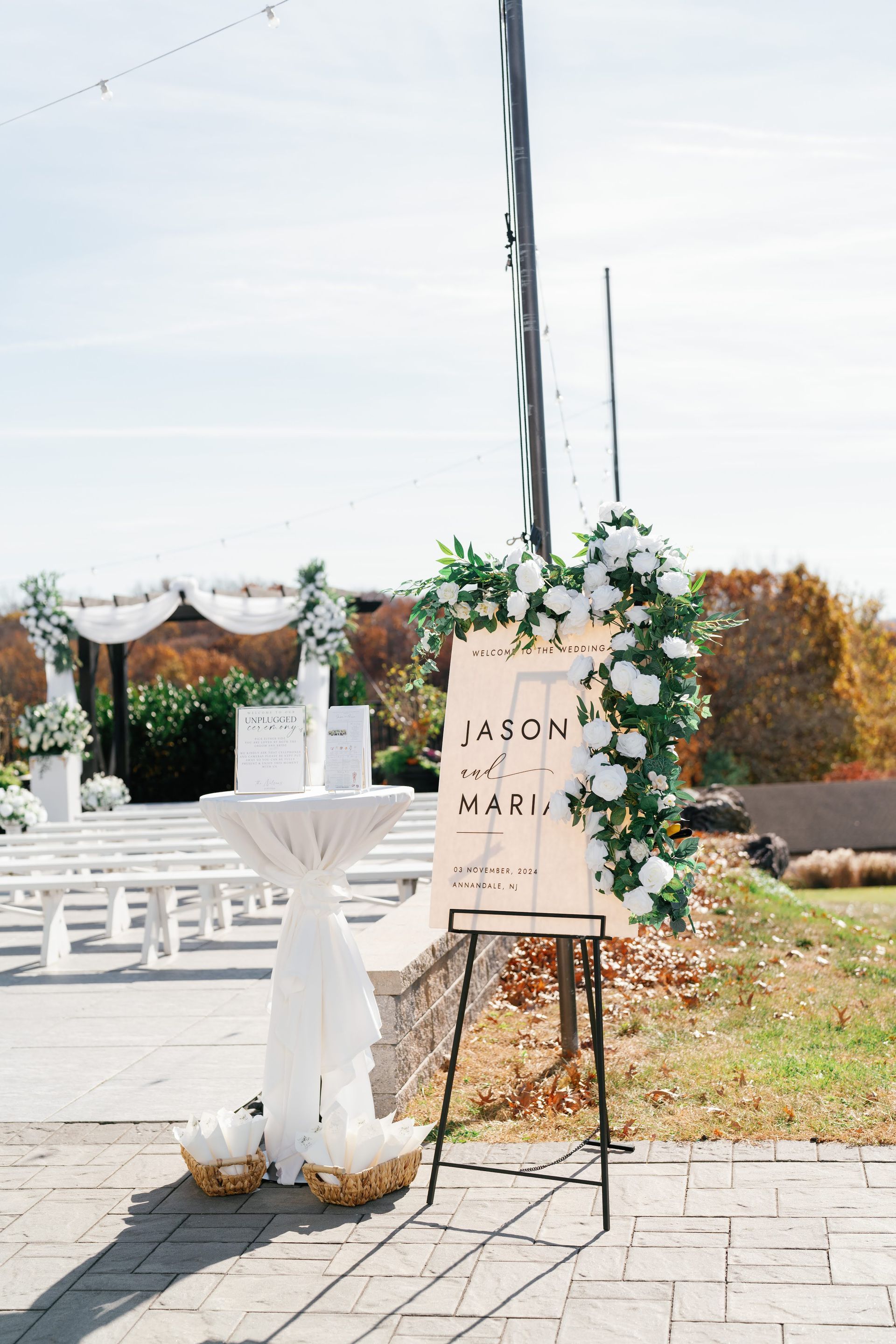 CEREMONY DECOR FLORALS ON WELCOME SIGN