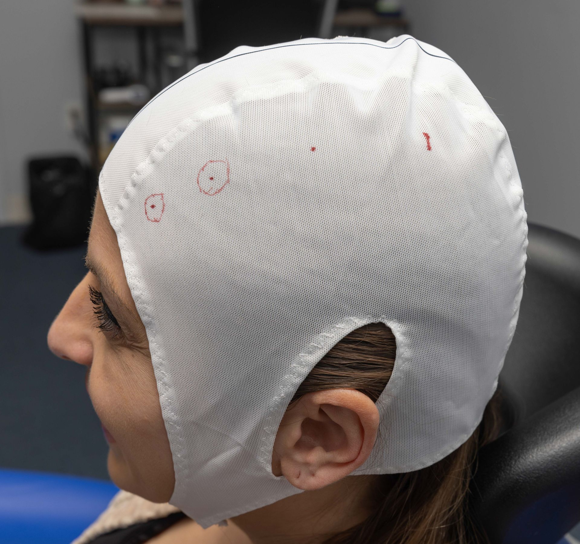A woman wearing a white bandage on her head