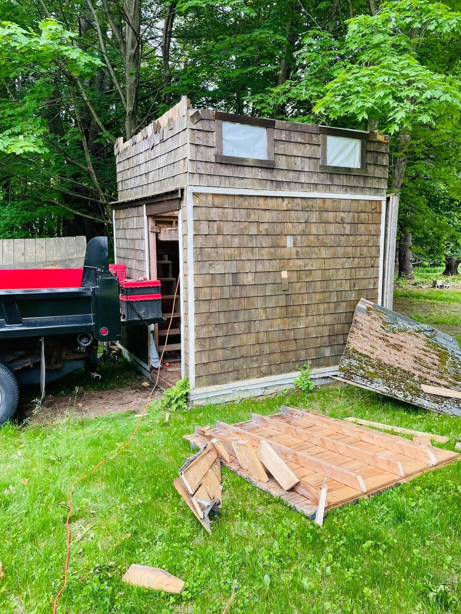 Finally Freedom Junk Removal performing shed demolition services