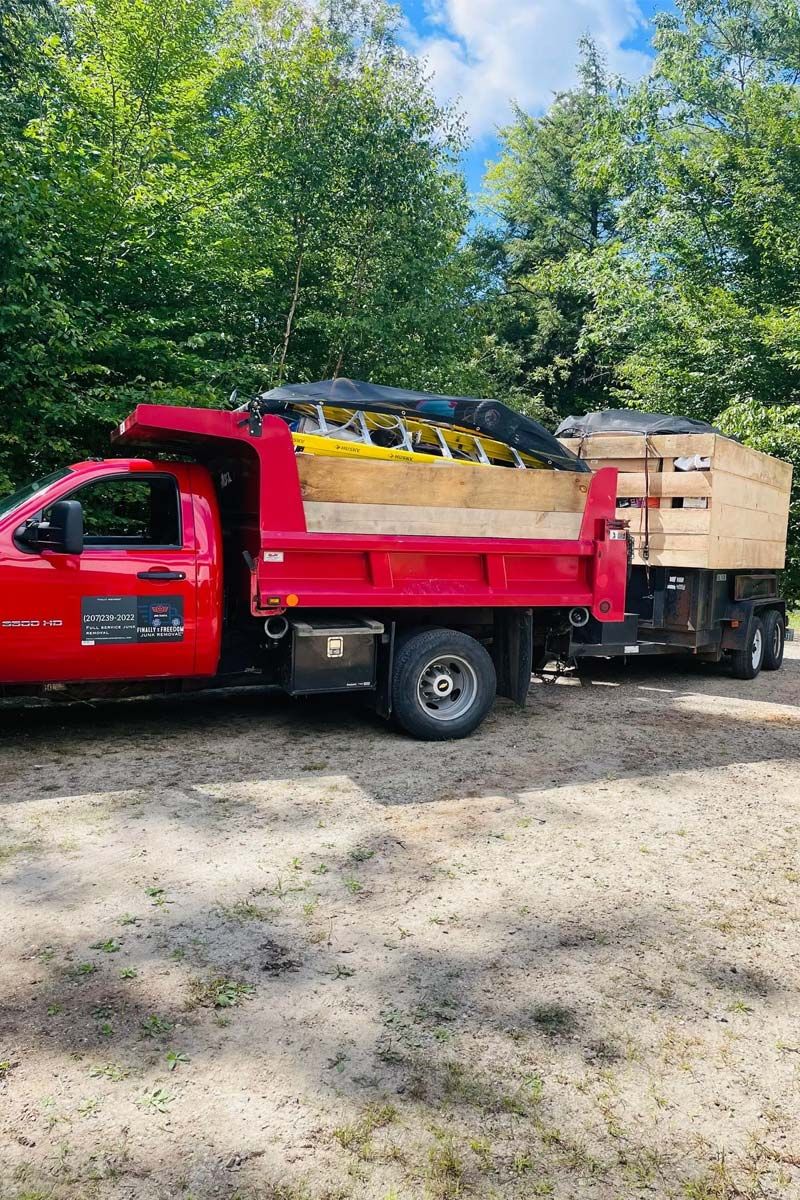 Image of the Finally Freedom Junk Removal truck providing estate cleanout services