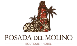 Logo for Posada del Molino boutique hotel with a red stone mill and palm trees above the name.