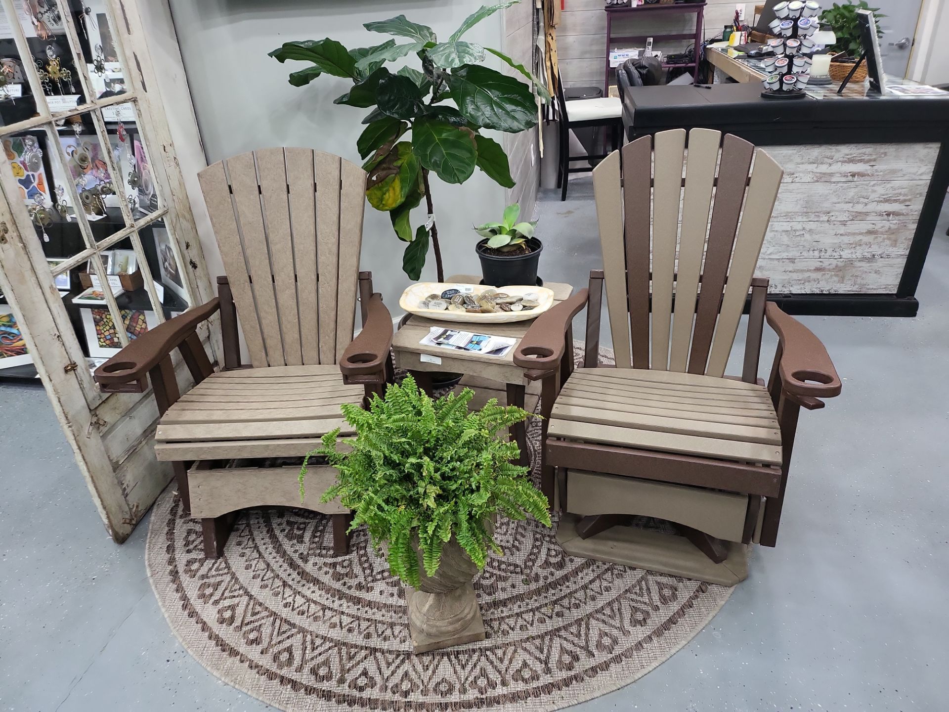 A couple of chairs sitting next to each other on a rug in a room.