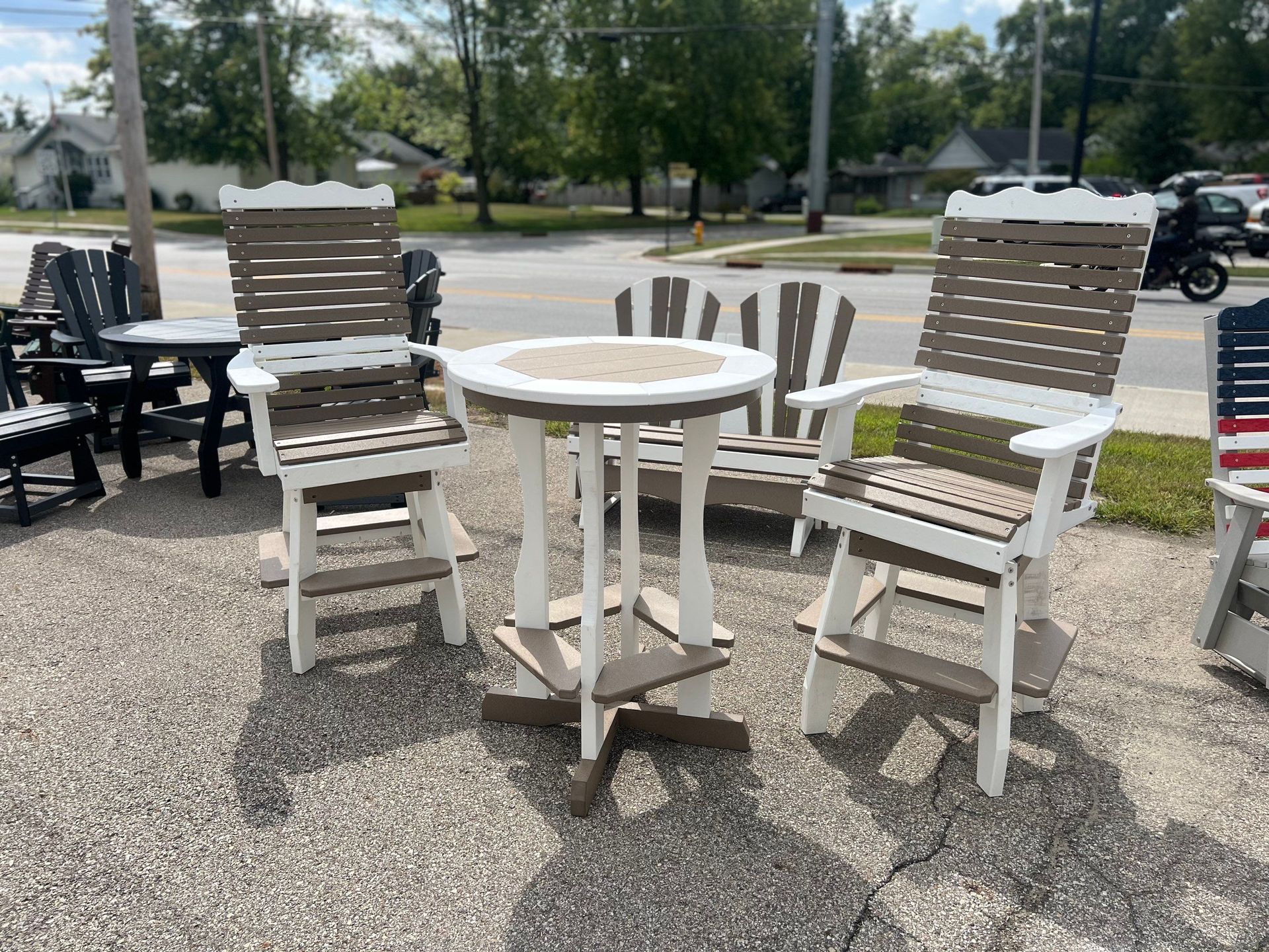 A table and chairs are sitting on the side of the road.