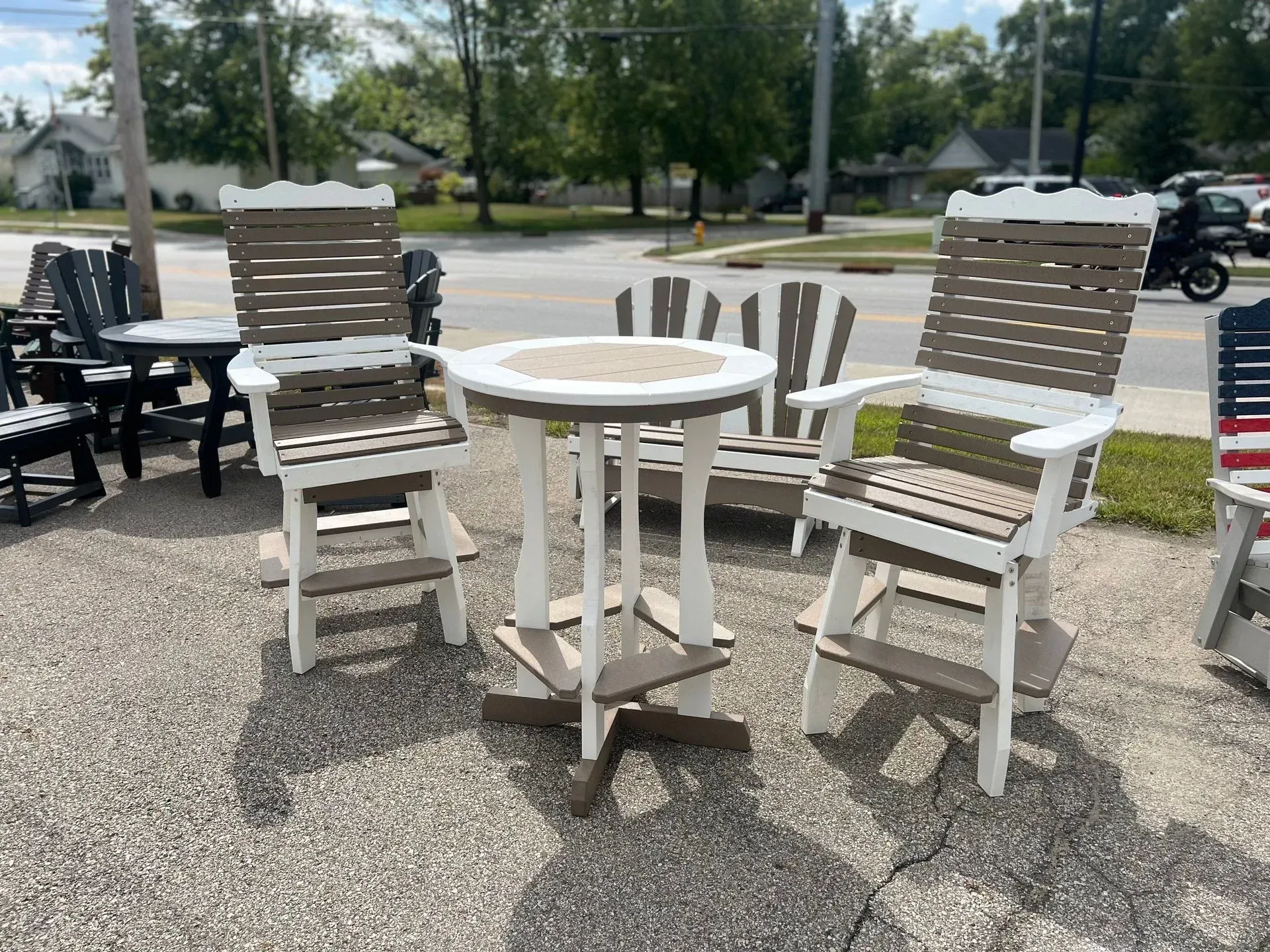 A table and chairs are sitting on the side of the road.