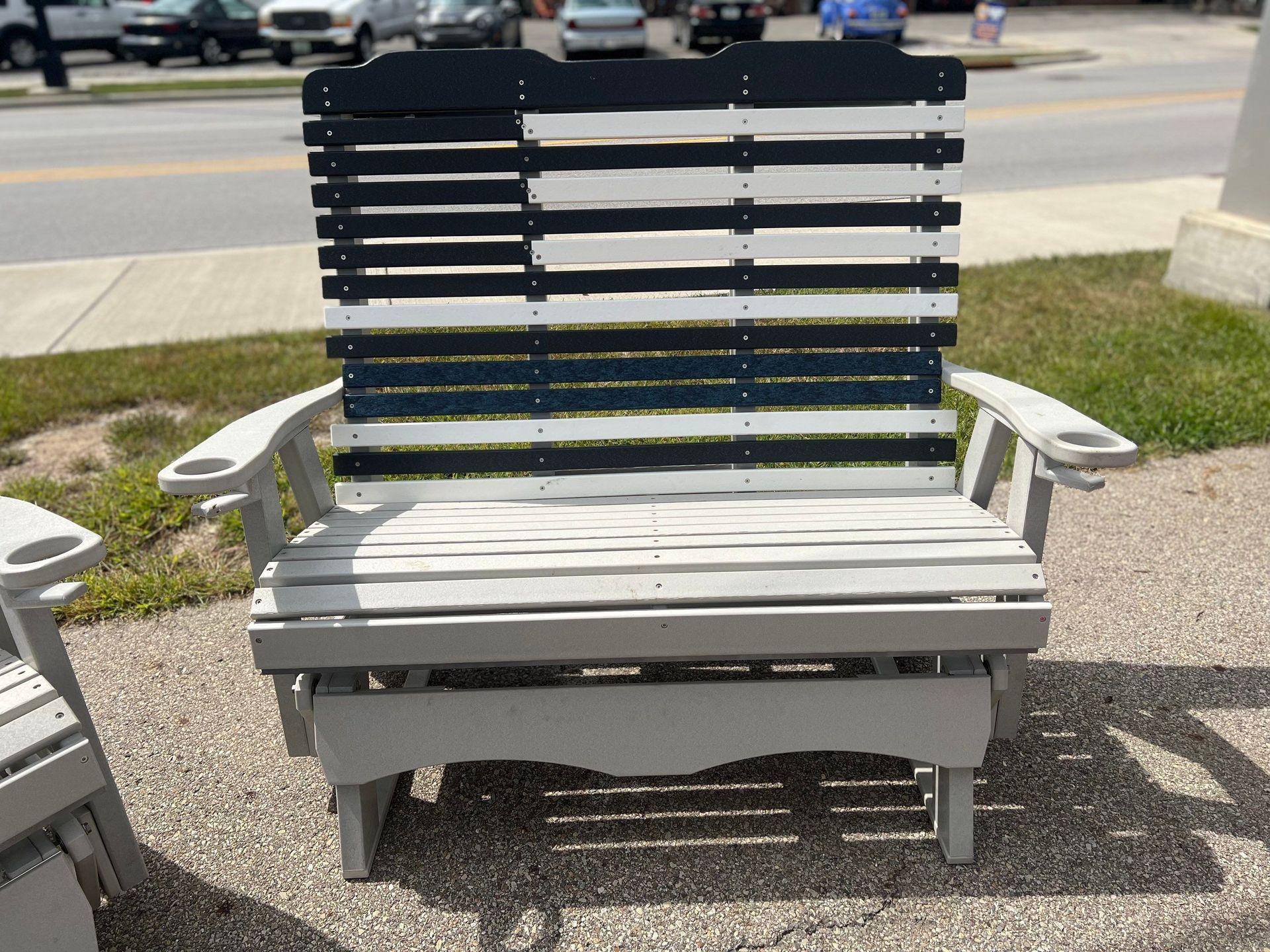 A wooden chair with a black and white american flag on it