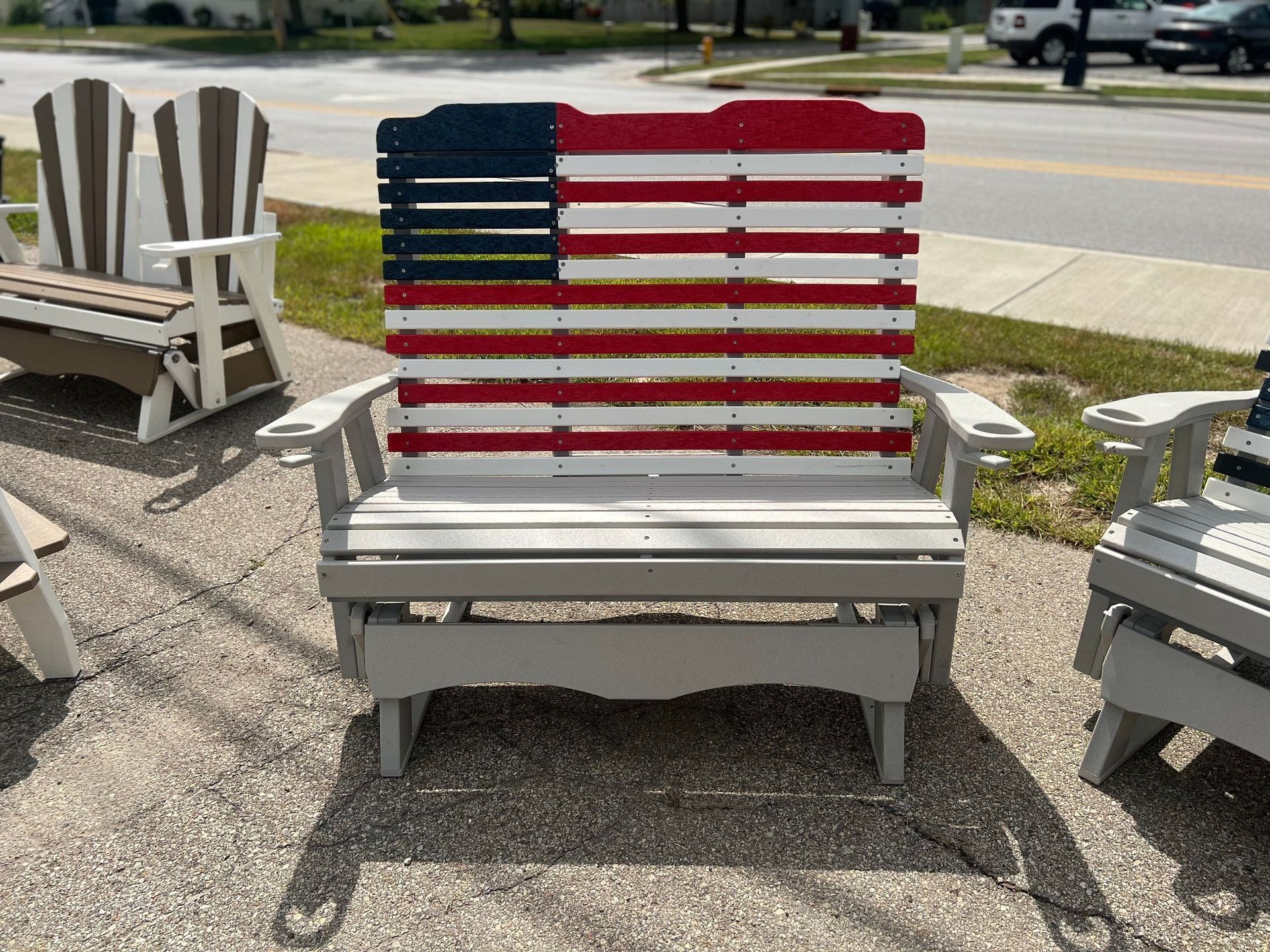 A wooden chair with an american flag painted on it.