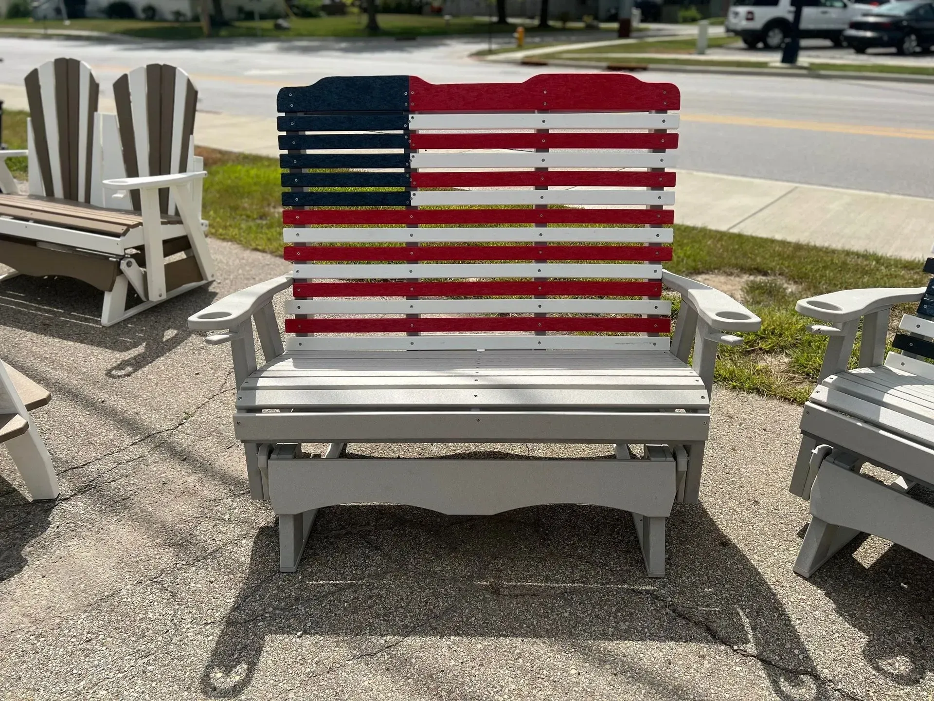 A wooden chair with an american flag painted on it.
