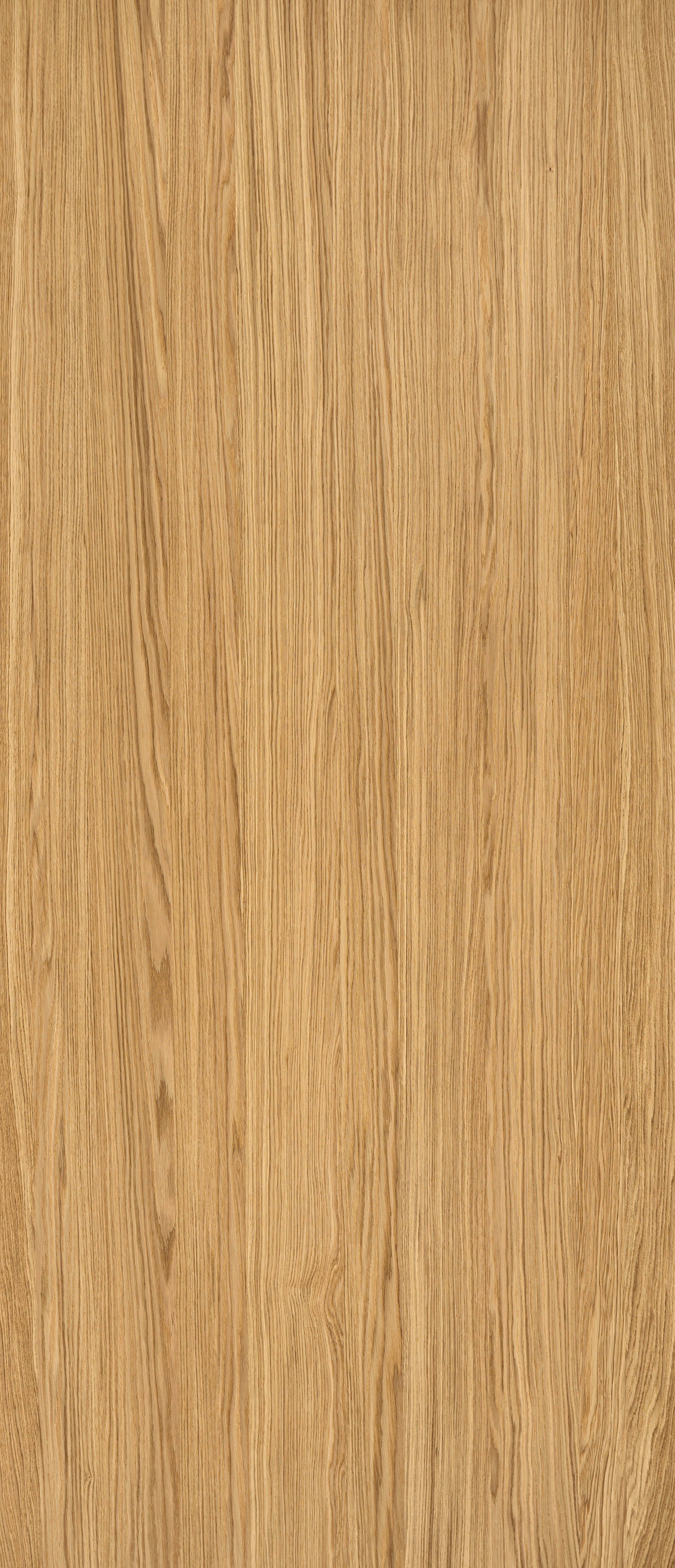 Close-up of light brown wood grain, with vertical streaks and variations in color.