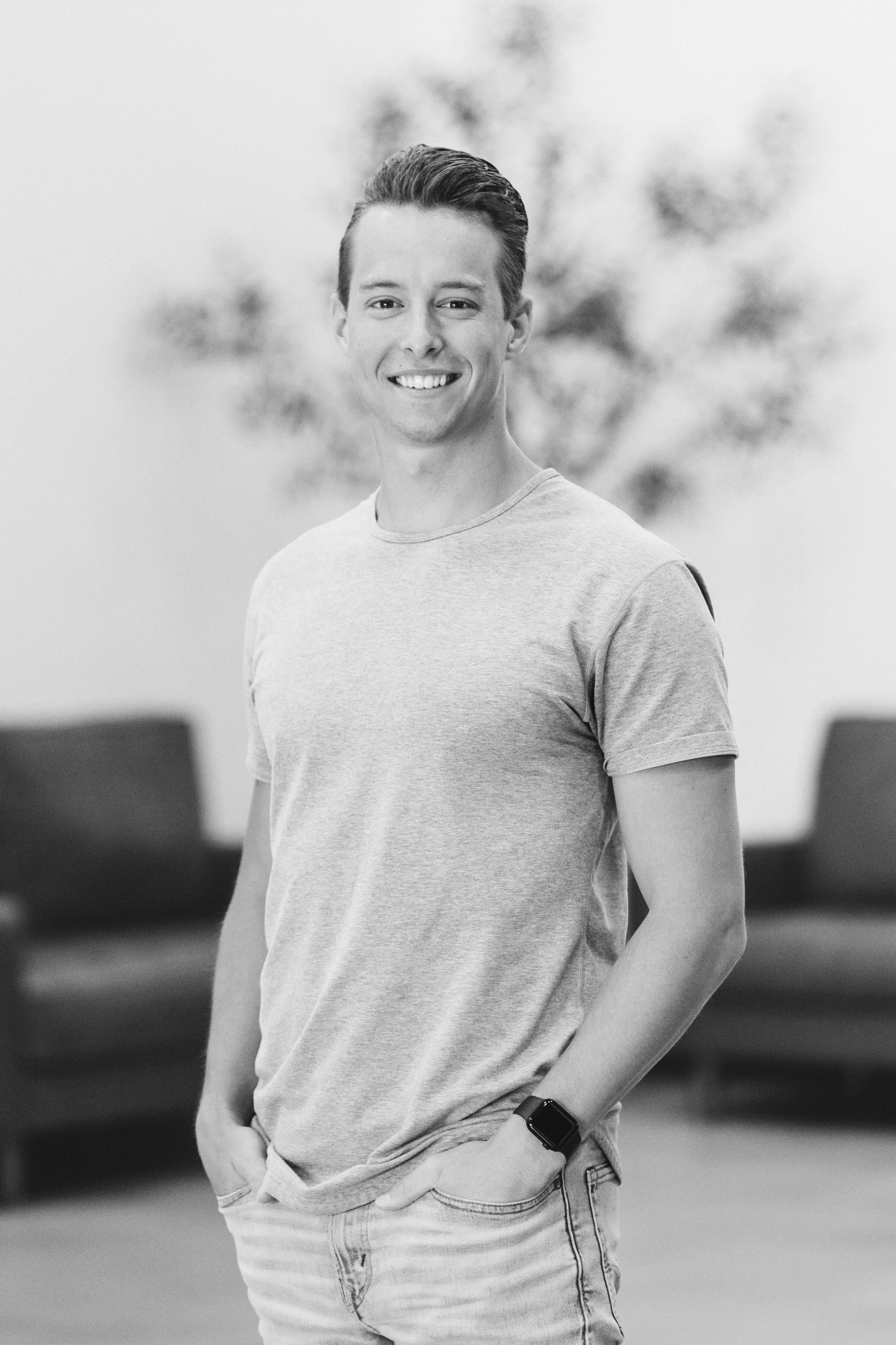 Black-and-white profile portrait of Pastor Blake Cruise smiling at the camera