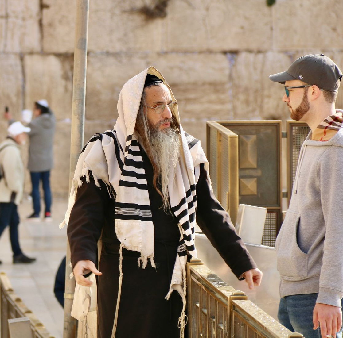 Rabbinic leader speaking with a pastor visiting the Western Wall in Jerusalem