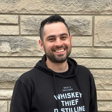 Picture of Cali, partner behind Thieves Run: Tabletop Hideout and 24-hour TTRPG space in Louisville, KY