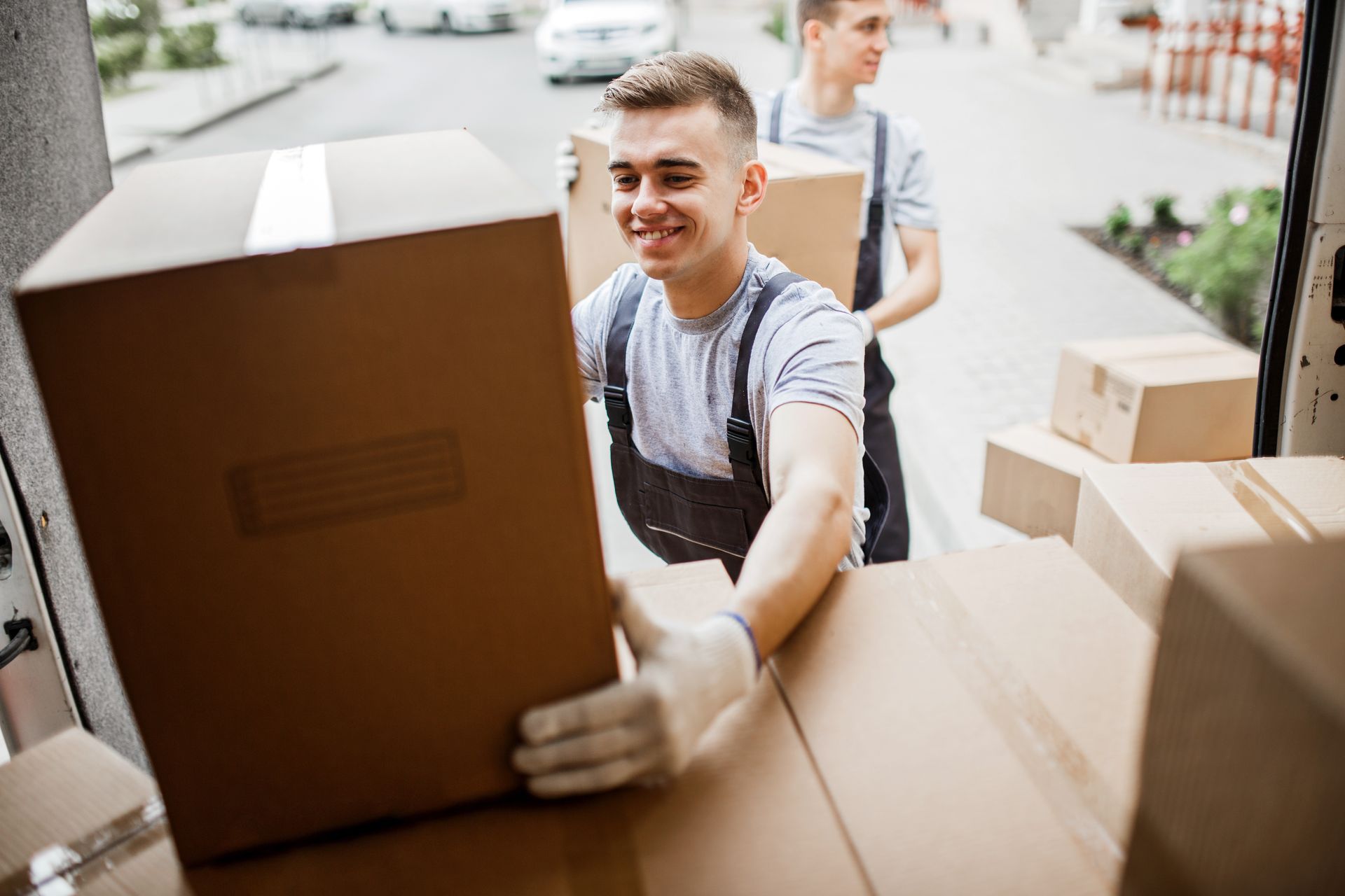 Movers are unloading boxes. Movers are unloading boxes.