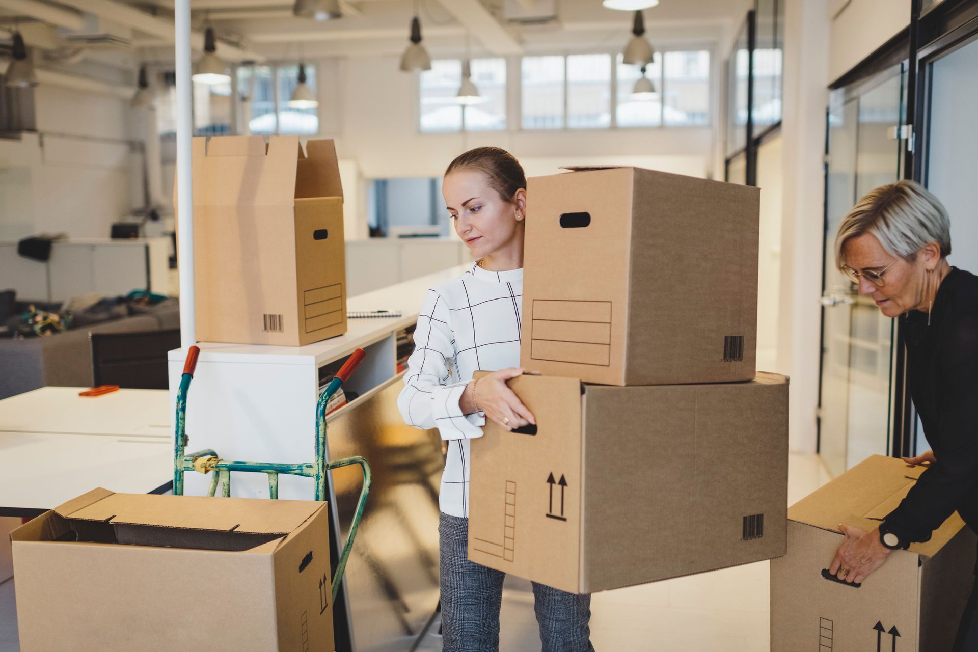 Woman holding a box Woman holding a box