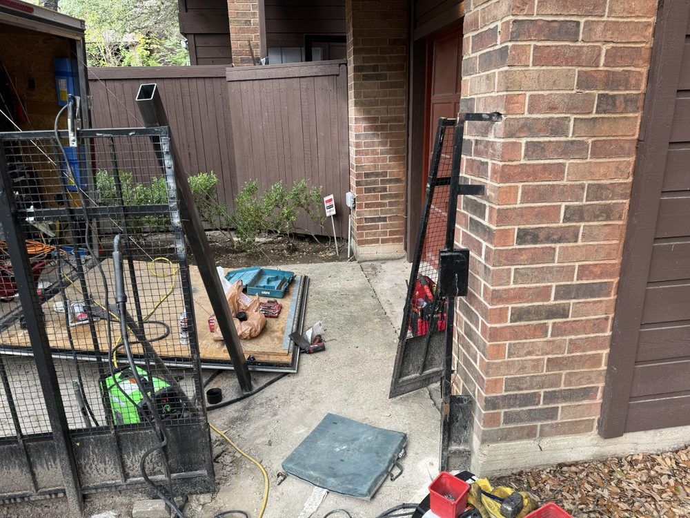 A woman is sitting at a desk with a laptop and talking to another woman.