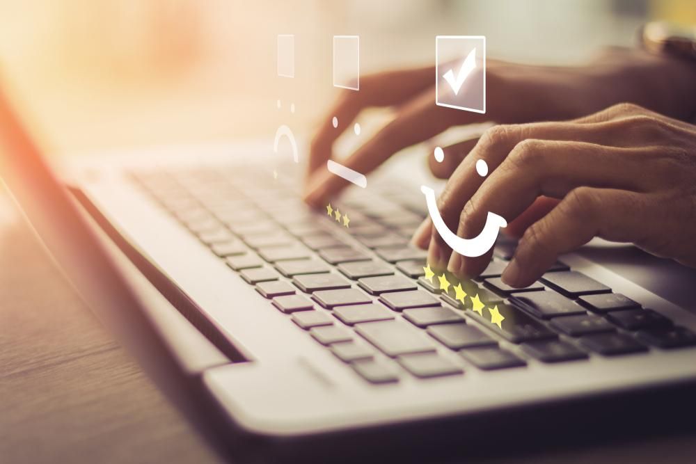 A person is typing on a laptop computer — River City Communications In Melinga, NSW